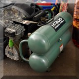 T32. Hitachi air compressor. Model EC 12. 